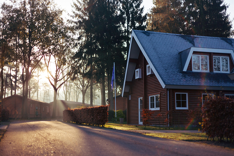 Secluded home surrounded by trees in Marquette, MI, representing the challenges and benefits of selling a house without a realtor.